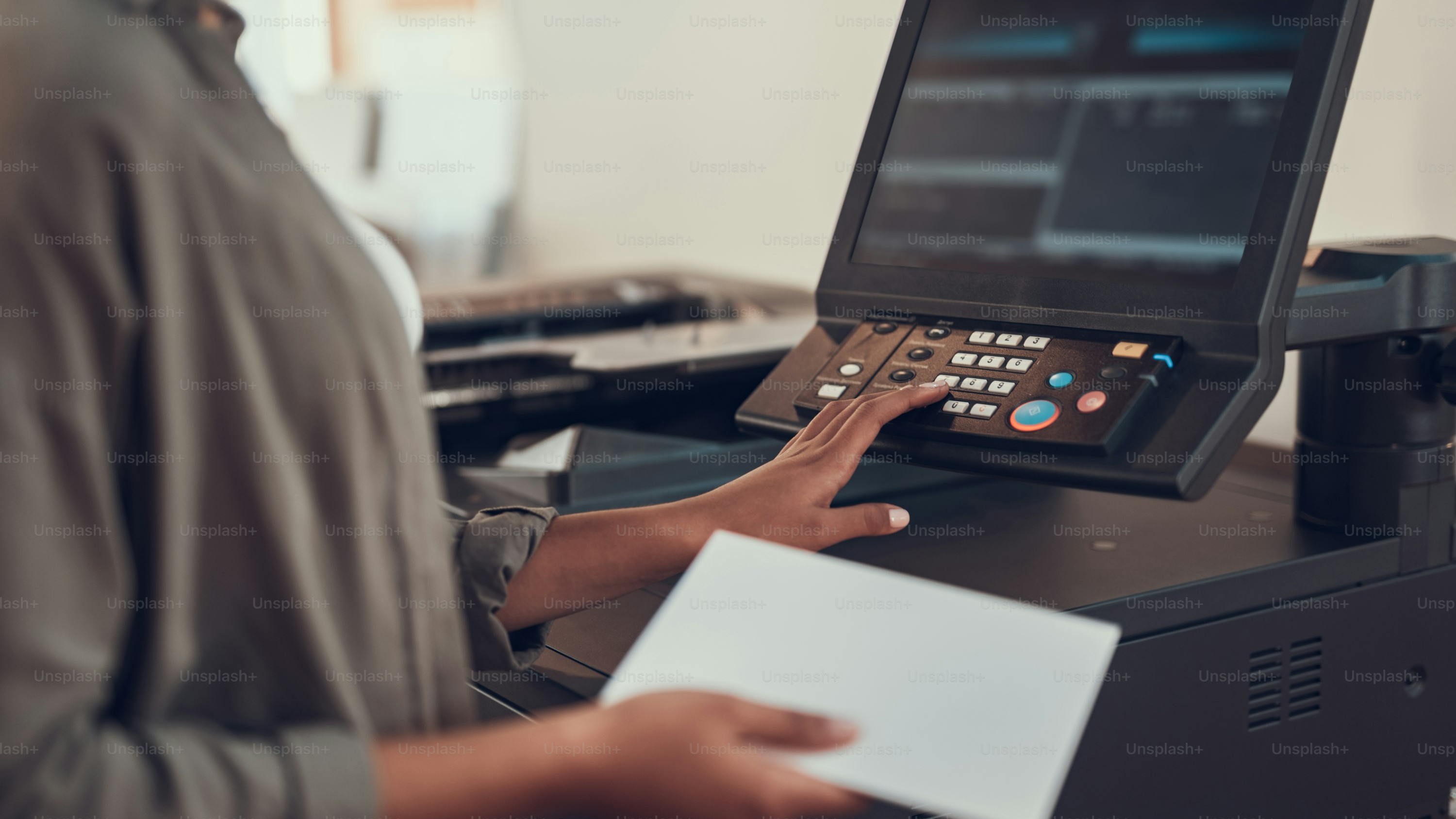 Close-up of modern office copier with scanner lid open during maintenance